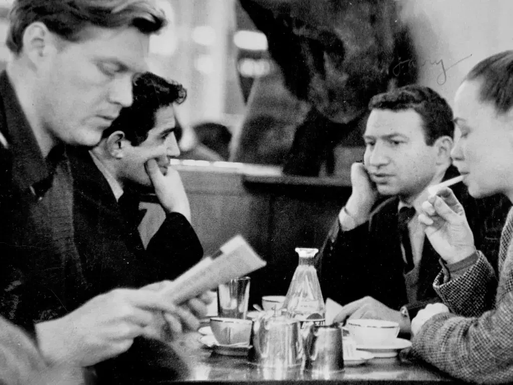 Jack Kennedy, Tony Jackovich and Larry Eisler sitting together at a café in Paris