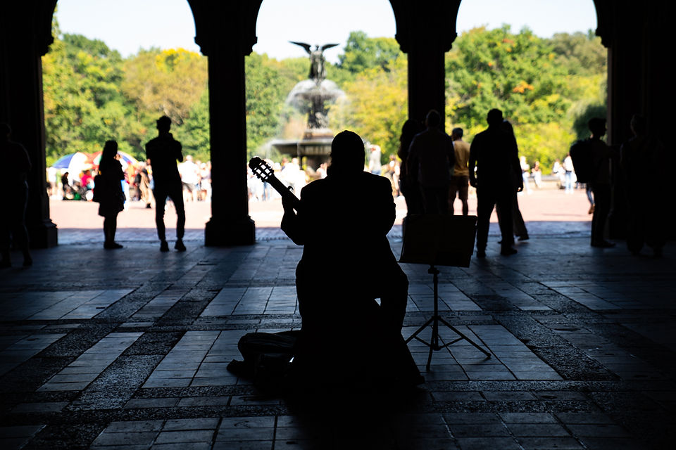 Man Busking In A Sheltered Tunnel In Front Of The Central Park Fountain, New York.