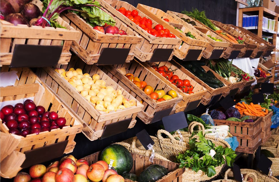 Wooden crates filled with colorful fruits and vegetables, such as apples, tomatoes, and carrots, line supermarket shelves with a rustic vibe.