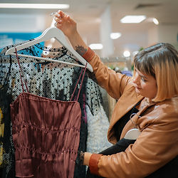 Fashion stylist showing styled outfit 