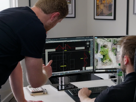 ACS architectural technicians reviewing plans for a building project in Norfolk
