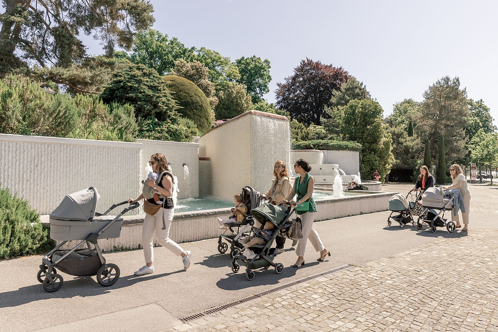 Group of mothers walking with their strollers in a residential neighborhood