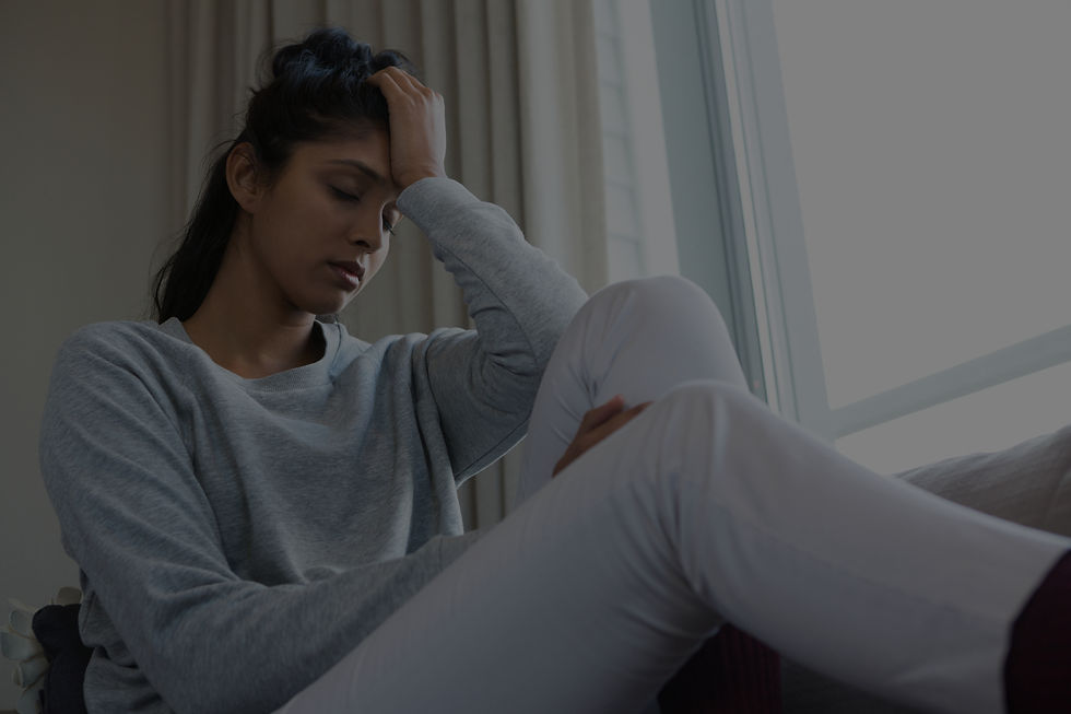 Woman sitting sad after grief | Therapy for Grief at Boundless in NY & MA