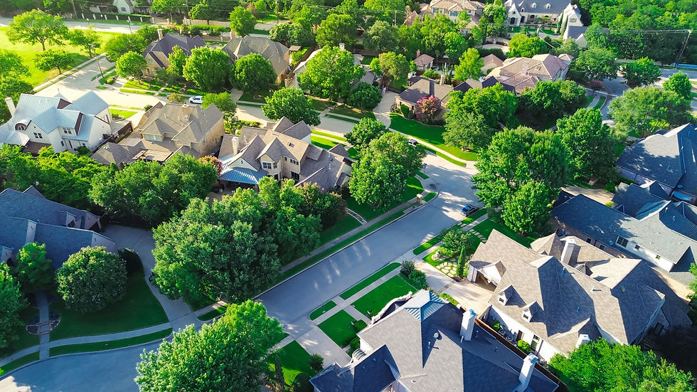 Cul-de-sac dead-end street in wealthy suburban neighborhood with large mansion houses in l