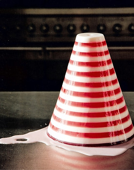 A red and white striped cone shaped jelly