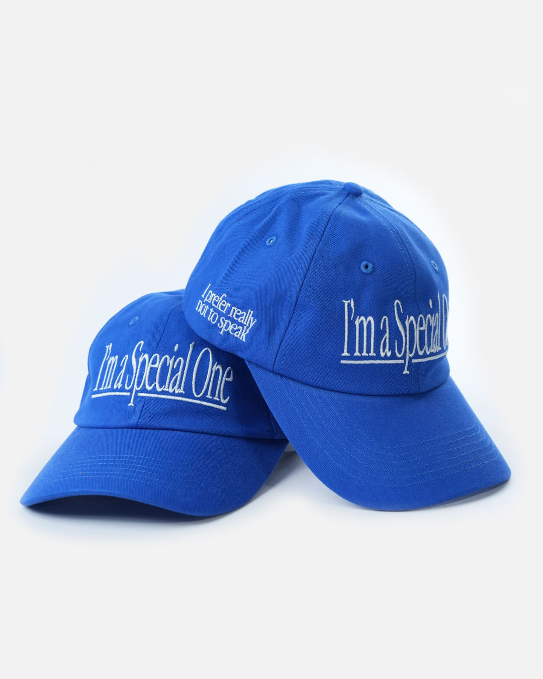 Two caps with “I’m a Special One” and “I prefer not to speak” embroideries.