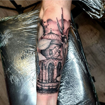 Chesterton windmill tattoo in black and grey 