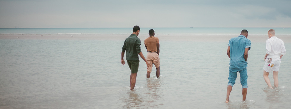 Male friends on beach, talking with friends or professionals can improve your mental health