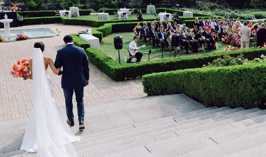Ceremony guitarist performs as bride walks down isle