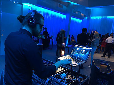 DJ Tylor mixing and DJ'ing and event in Dallas