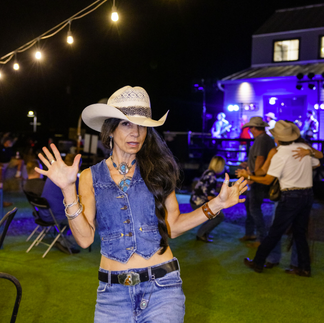 Posing in front of Champagne Nights band