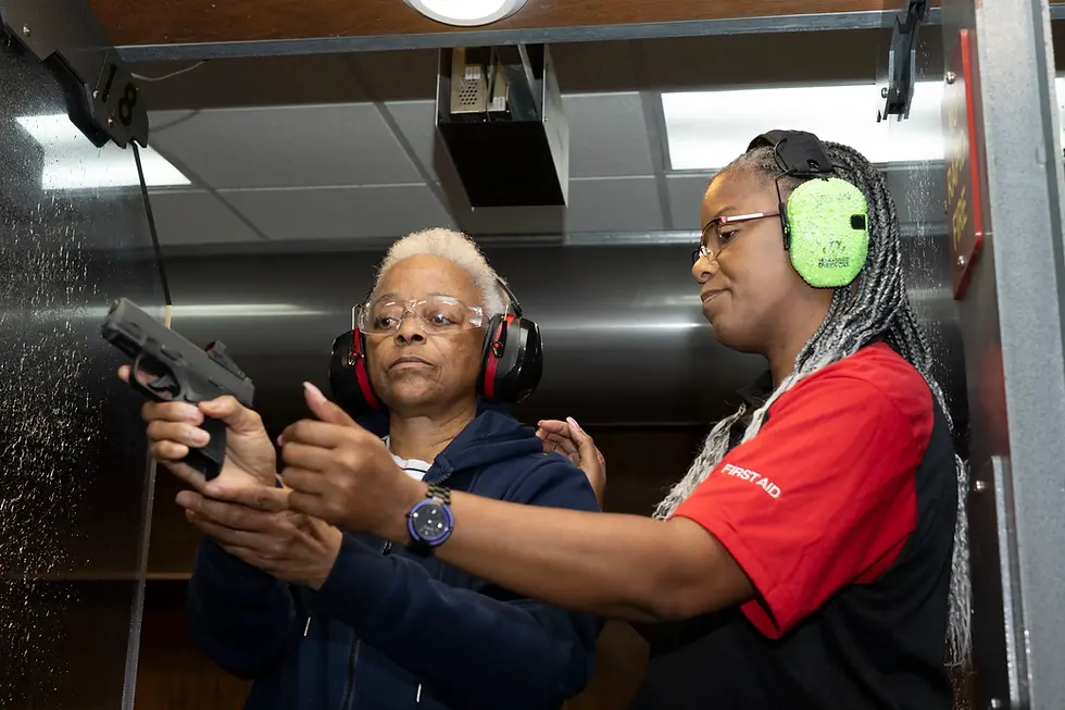 Close-up view of a person practicing firearm safety at a shooting range