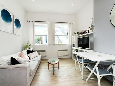Cozy living room with sofa, table, and TV; modern design and decor.