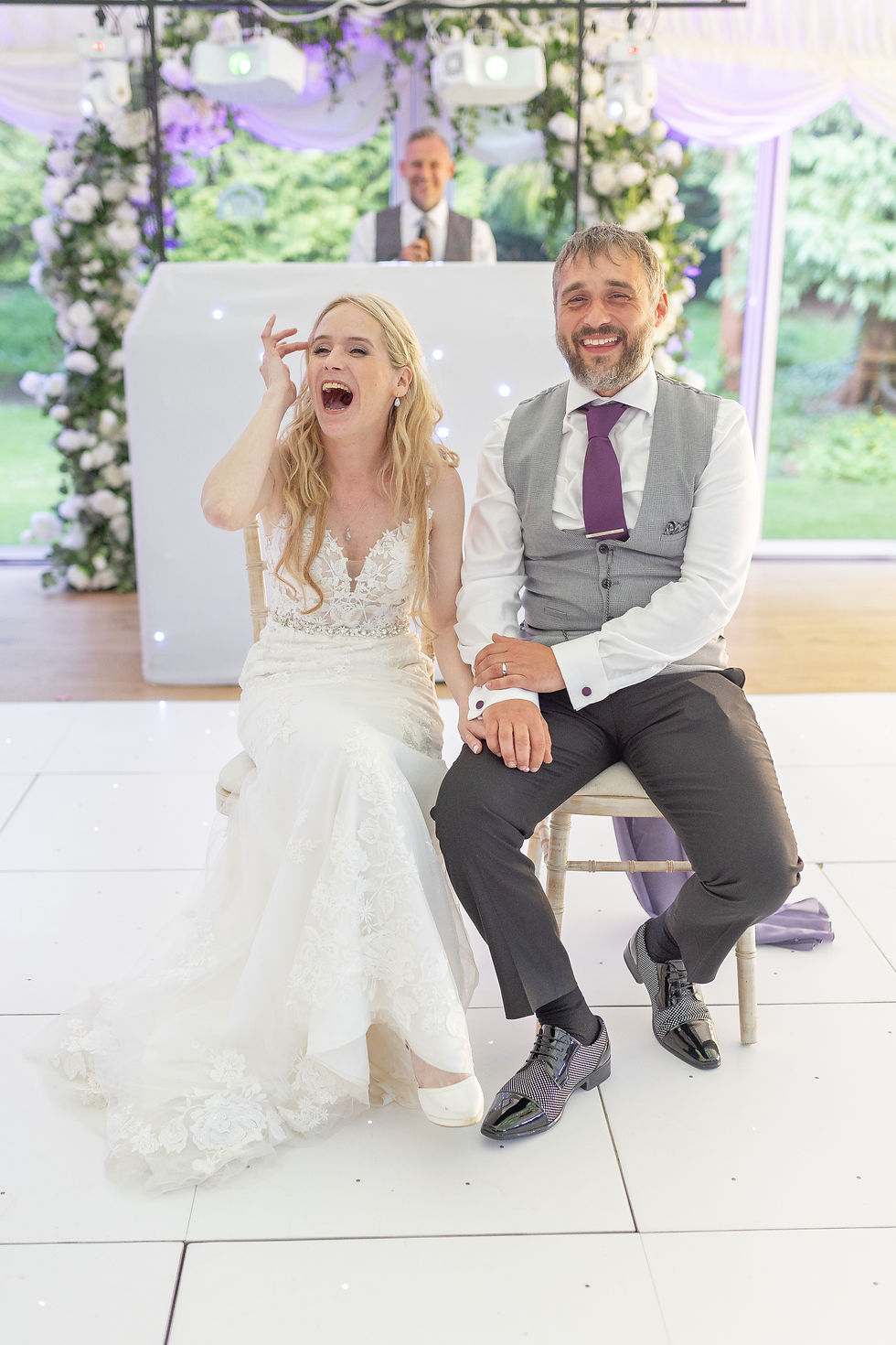 Second photographer capturing the bride and groom