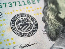 why does the fed raise interest rates