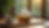 Eye-level view of a glass teapot brewing organic herbal tea on a wooden table