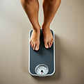 a person standing on a scale.jpg