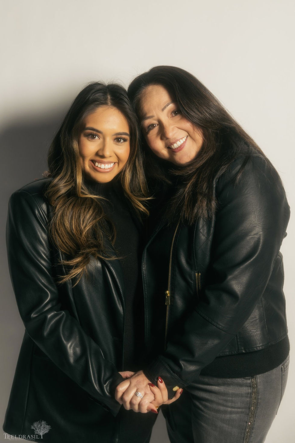 Mother and daughter in matching leather jackets