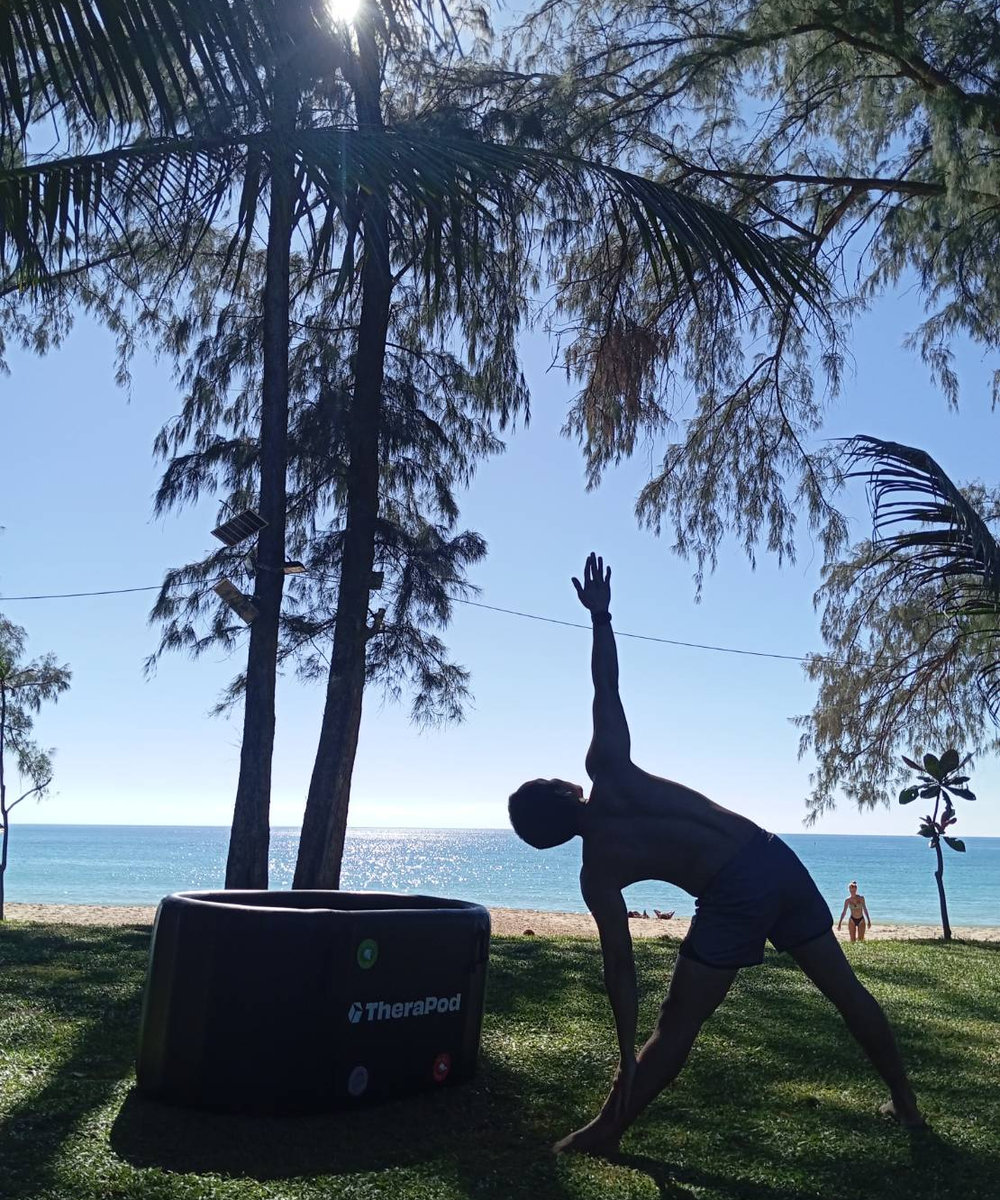 Guest entering the seaside ice bath after a yoga session at Long Beach Chalets