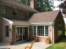 2-storey home with small, one-storey brick extension