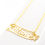 Thumbnail: 14k yellow gold namplate necklace in a cursive font with heart on the "i" with a diamond cut butterfly at the end