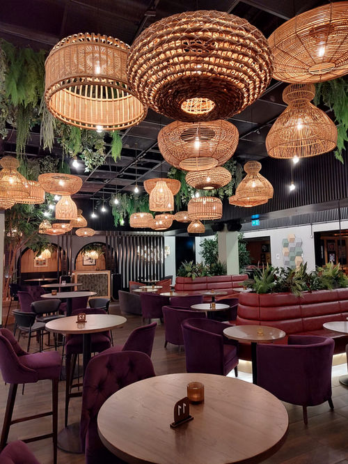 Gala dinner setup at a corporate event, with elegantly arranged tables, lighting, and decorations.