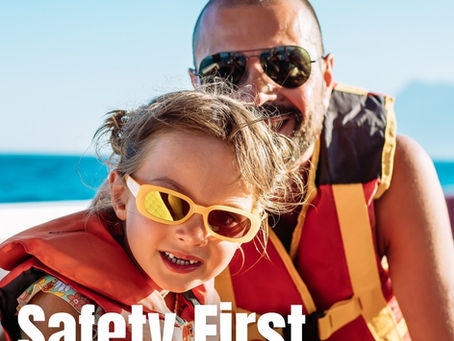 Child and parent wearing life jackets and sunglasses smiling on a boat in Southern California, with Touchless Cover® message “Safety First is for all ages,” promoting family boating safety and stress-free protection.