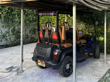 Outdoor golf cart parking setup with a protective cover system for homes with limited garage space.