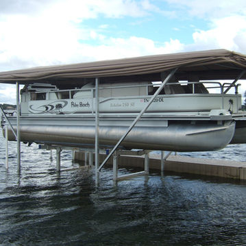 Touchless Cover® protecting a pontoon above the deck on a boat lift in Central Florida, with the seating and helm area sheltered from daily exposure