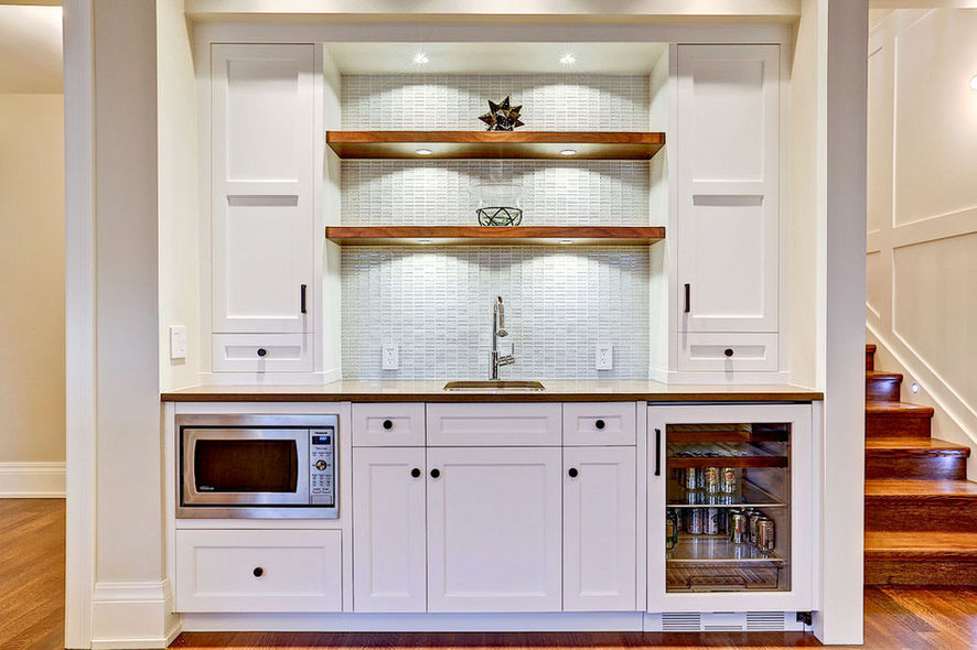 Picture of a new bar with white cabinets and wood wall shelves