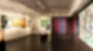 Interior view of the Lu Mourelle Art Gallery in Cascais, Portugal, featuring original contemporary paintings and mixed media artworks in a curated exhibition space.