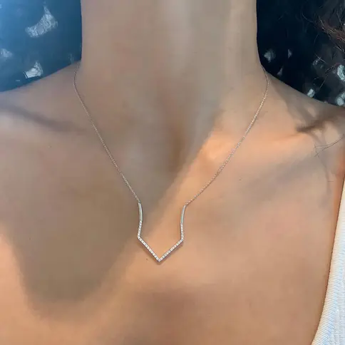 Delicate V-shaped necklace on model