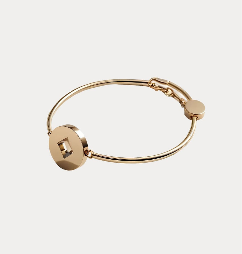 Gold bangle bracelet with circular detail
