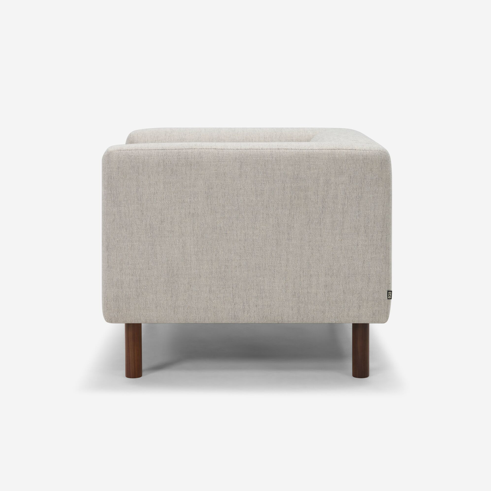 Beige fabric sofa side view, simple design