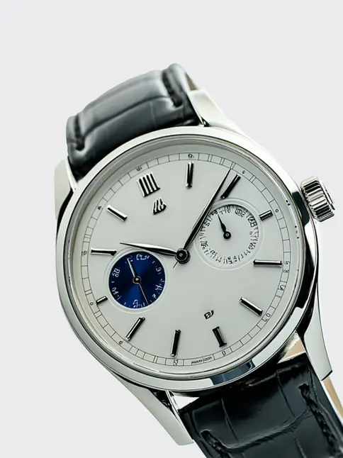 Vintage-inspired watch with white face, blue sub-dial, black leather strap