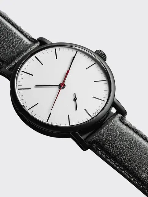 Vintage-inspired watch with black strap and white dial