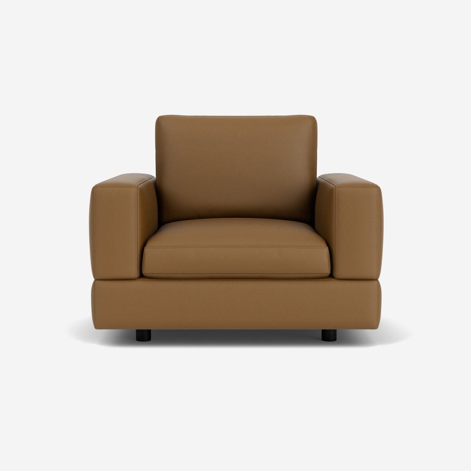 Brown leather armchair with square arms and a simple design