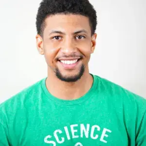 Smiling young man in green SCIENCE shirt