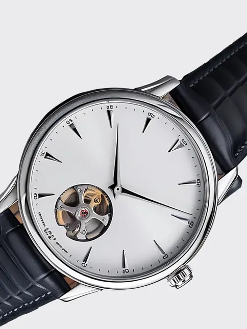 Vintage-inspired watch with open heart dial