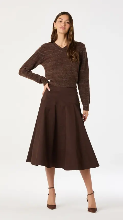 Model wearing Jackeline Asymmetrical Scarf Cardigan and skirt.