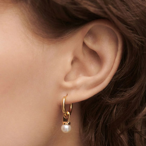 Gold hoop earrings with pearl detail