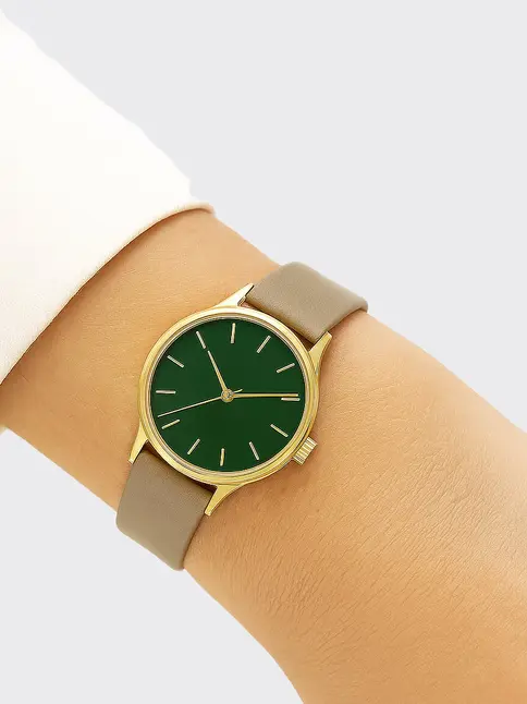 Vintage watch with green dial, gold case, taupe strap