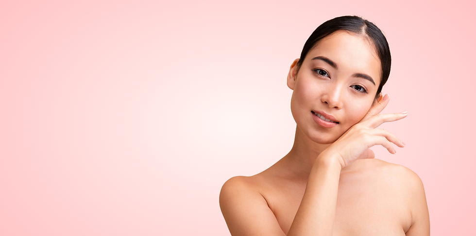 Young Asian woman smiling, touching her face, plain background, Cerla Beauty.