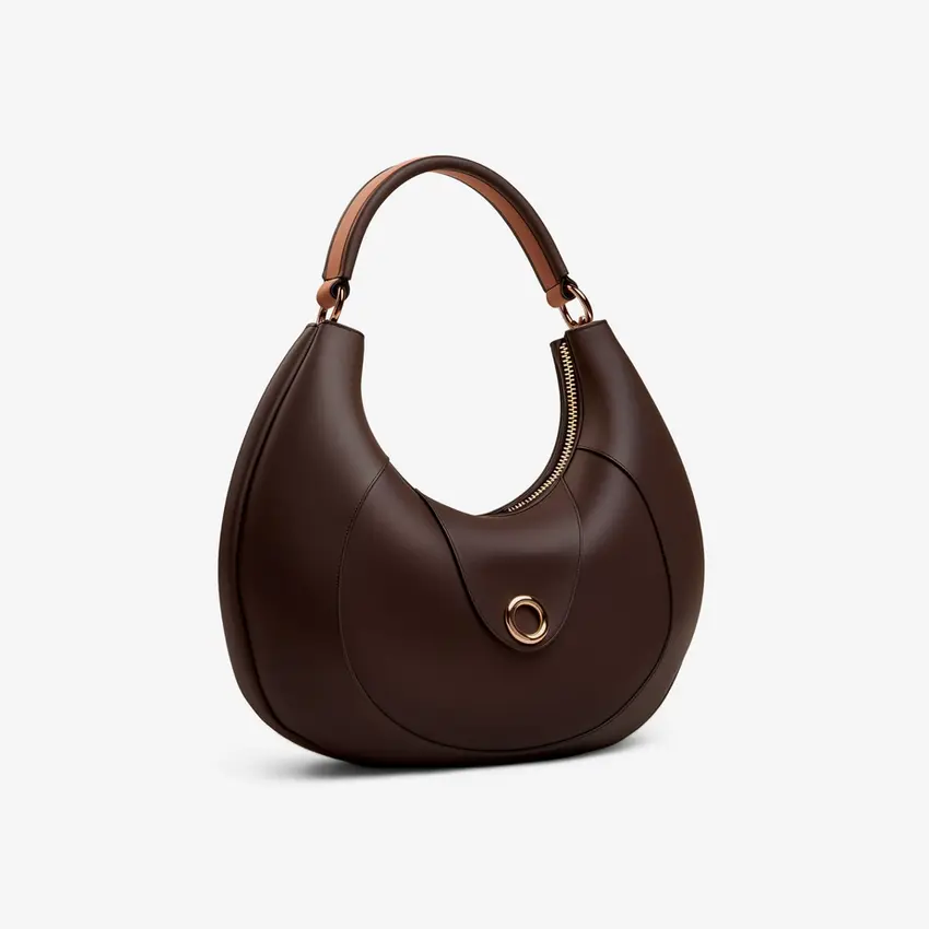 Elegant brown leather handbag with a curved shape, handle, and clasp detail.