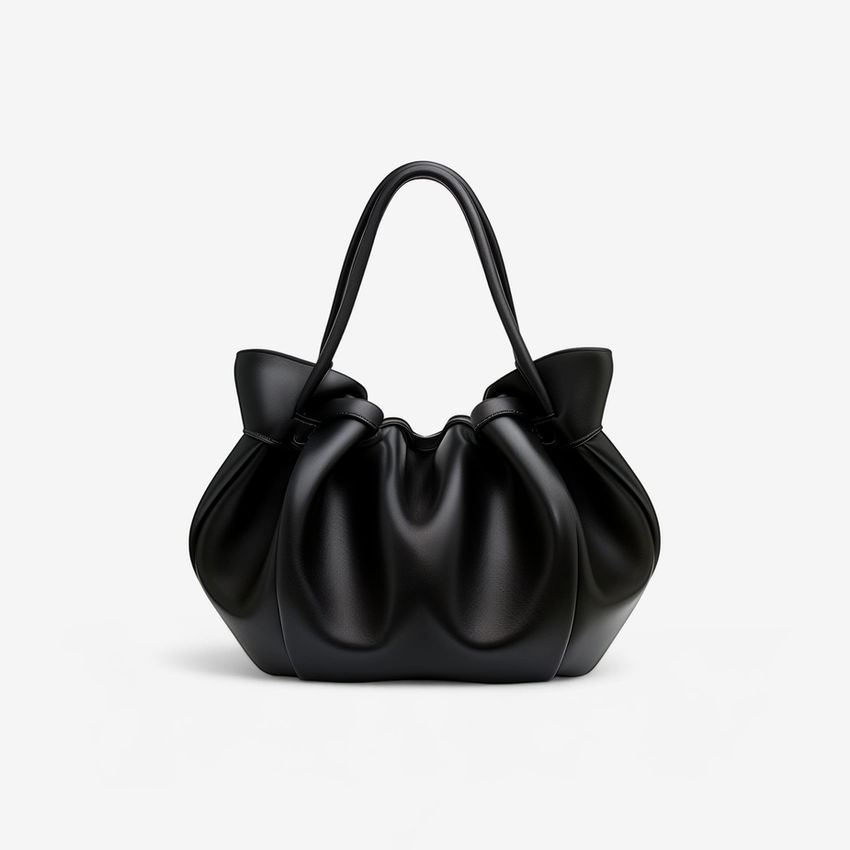 Black gathered handbag with handle, stylish accessory for everyday use.