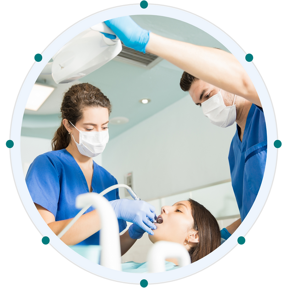 Dental team performing checkup with patient