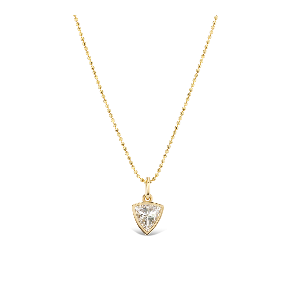 Gold necklace with a heart-shaped pendant on a black background