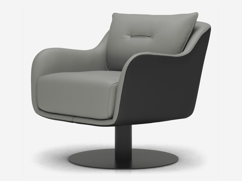 Gray leather armchair with swivel base, modern design, studio shot.