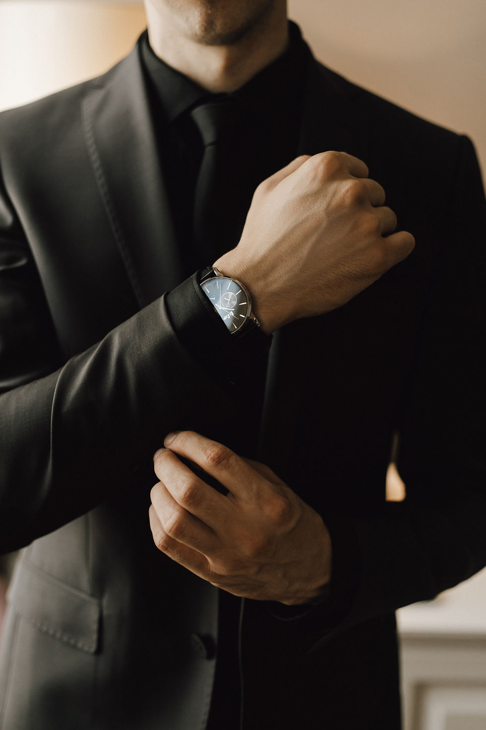 man-fastens-cufflink-his-business-suit.jpg