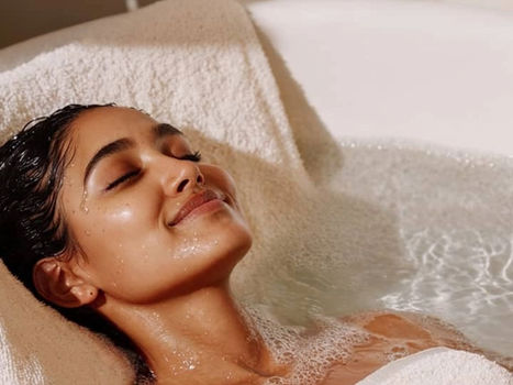 Woman relaxing in a bath with natural soap